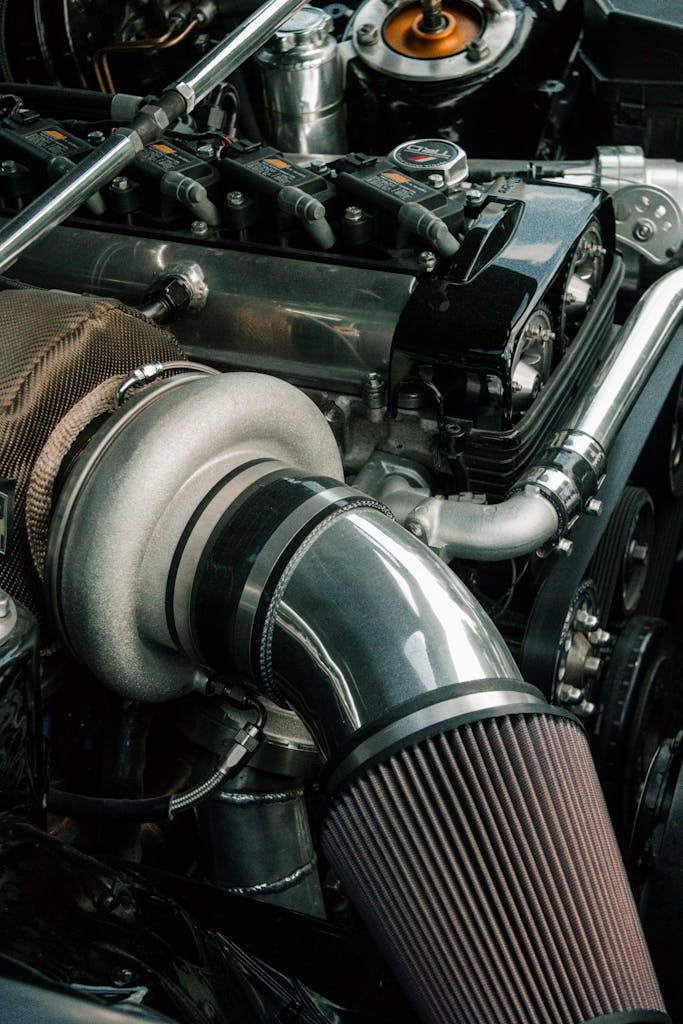 High-resolution image showcasing intricate details of a car engine and its components.